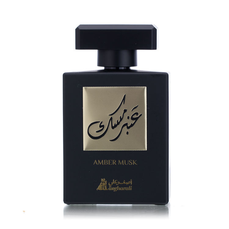A black perfume bottle with a gold label, displaying the name 'AMBER MUSK' on the front.