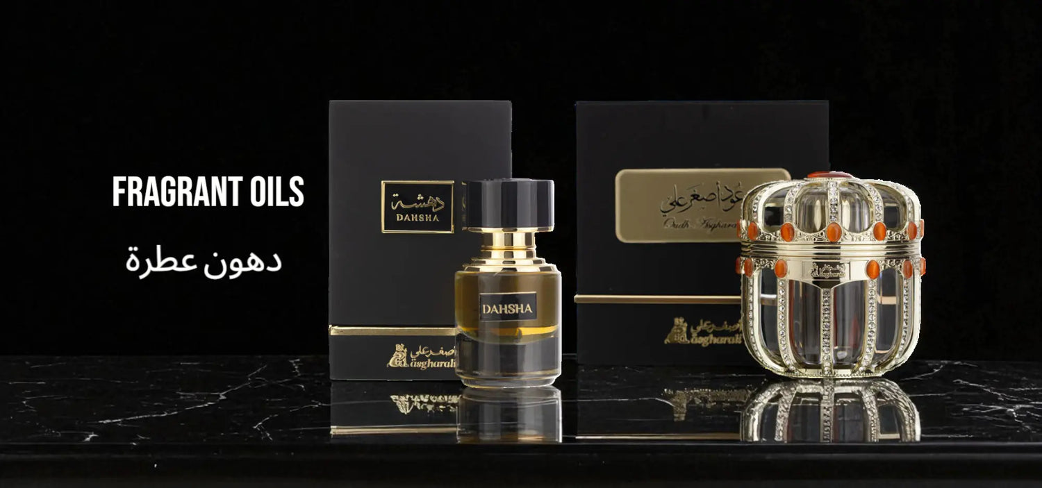 Two perfume bottles with their packaging on a black marble surface, featuring the brand 'Afnan'.